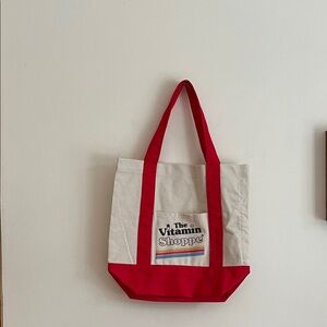 The vitamin shoppe Red and Cream Tote Bag